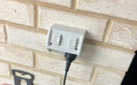 Compliant outdoor electrical outlet installed at a property in Redcliffe