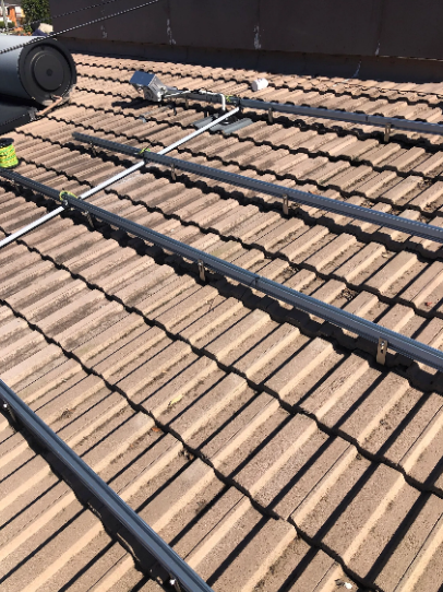 Solar panel frames during system installation at a property in Moorooka