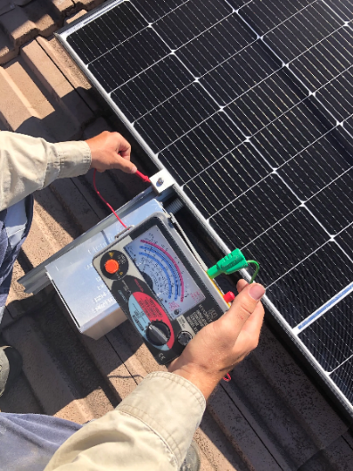 electrical test performed on solar panel using a multimeter at a property in Moorooka