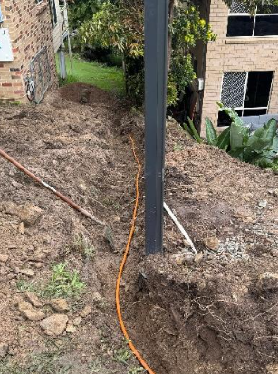 new electrical main cable being installed during excavation at a property in Beenleigh