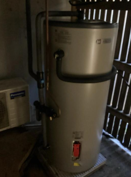 non-compliant hot water system under a property in West End