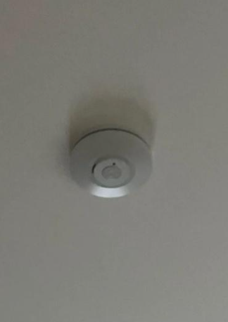 An image of an old, non compliant smoke alarm in Sherwood.