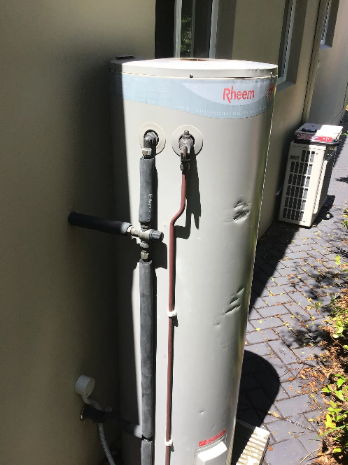An image of an older, dated hot water system at a household in Cleveland that was experiencing hot water system failures.
