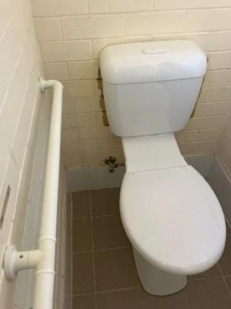 outdated toilet at a property in Coolum Beach