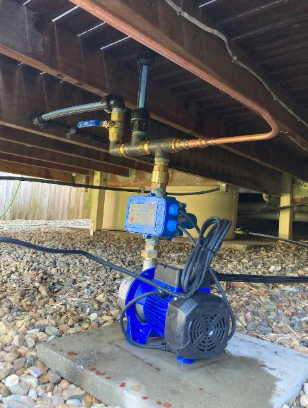 The disconnection process for removing an old rainwater tank in Wynnum.