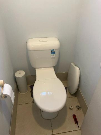 toilet with old cistern to be replaced at a property in southport
