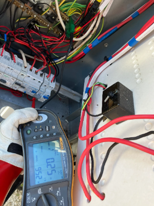 electrical testing on switchboard using a multi-tool at a property in Wynnum