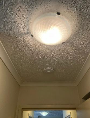 new hardwired smoke alarm installed at a property in Fortitude Valley