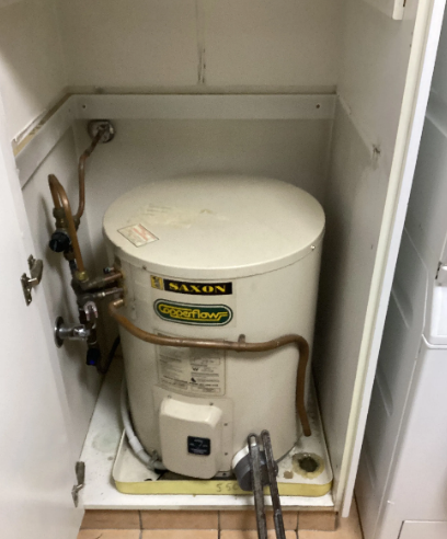 old hot water system to be replaced at a property in southport