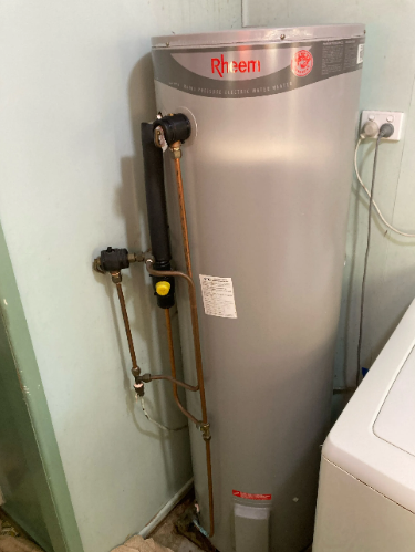 old rheem electric hot water system to be replaced at a property in Sunnybank