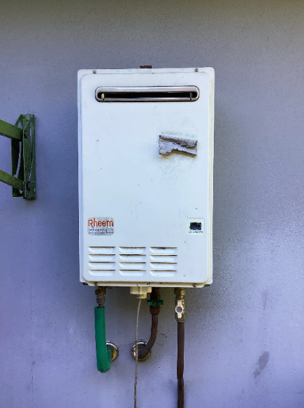 old rheem gas hot water unit to be replaced at a property in Chermside