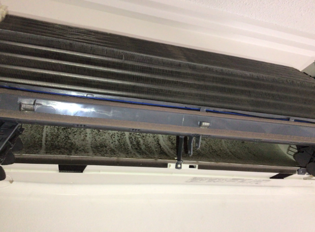 dirty split system air conditioner with broken fan to be repaired at a property in West End